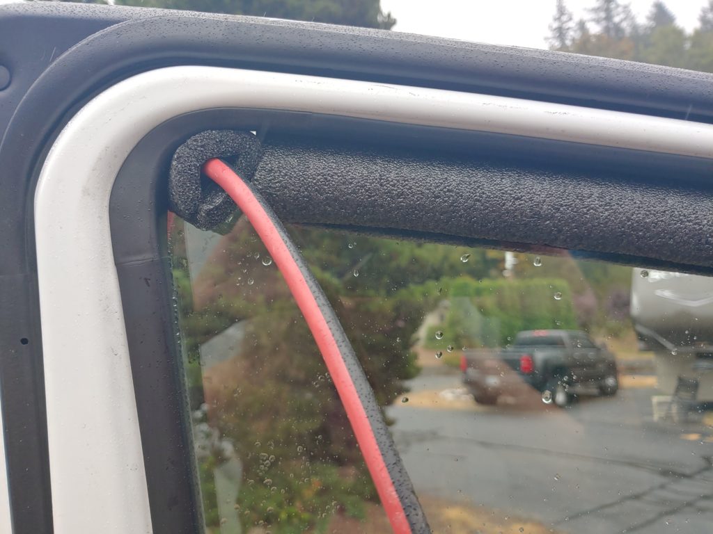 Makeshift waterproofing of extension cord coming into van