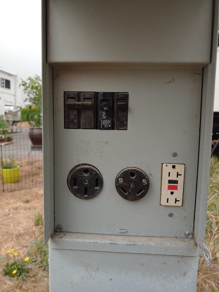 A shore power hookup at an RV park in Brookings Oregon